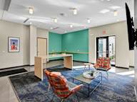 A room with a green wall and a white ceiling.