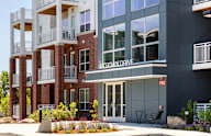 a building with a entrance and a sign on the side of it