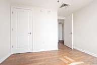 A white door is on the left and a white door is on the right.