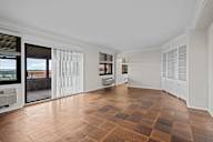 A large empty room with a checkered floor.