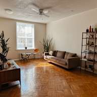 a living room with a couch and a window