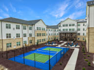Active Adult birds eye view of courtyard and pickleball courts