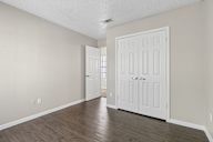 A room with a white door and a window.