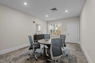 Active Adult conference room with a round table and chairs