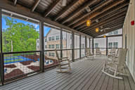 Active Adult Apartments with a covered deck with rocking chairs