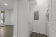 A white room with a door and a window.