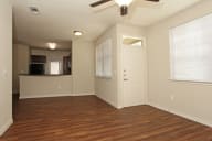 vacant apartment living room and kitchen in background