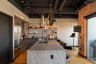 A modern kitchen with a large island in the center.
