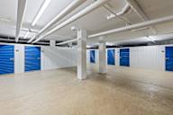 A storage room with blue doors and white walls.