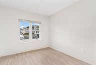 A room with a window showing a street view.