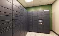 A row of lockers in a room with a green wall at Hudson Heights Apartments, Mechanicville, NY