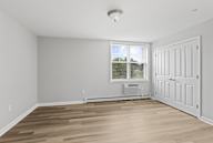 A room with a window and a door.