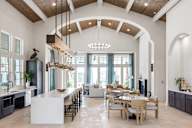 Clubhouse with kitchen and seating areas at Saltaire Apartment Homes in Santa Rosa Beach, FL