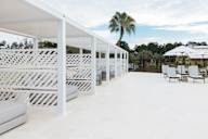 Cabanas and chairs at the pool at Saltaire Apartment Homes in Santa Rosa Beach, FL