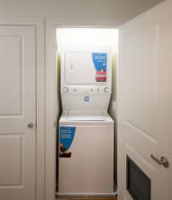 a white washer and dryer in a room