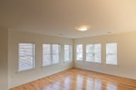 an empty room with a row of windows