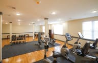 a room filled with lots of different types of exercise equipment