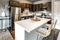 kitchen with stainless steel appliances at Sterling at Prairie Trail in Ankeny, IA