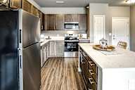 Kitchen with stainless steel appliances at Sterling Prairie Trail in Ankeny, IA