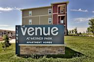 A sign for The Venue at Werner Park Apartment Homes.