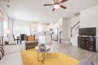 Airy living space with natural light, hardwood floors, and a perfect blend of comfort and style