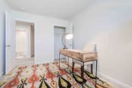 Cozy living space filled with natural lighting and ample space for relaxation and personal touches