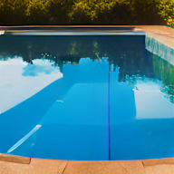 a swimming pool with a reflection of the trees in it