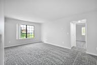 A room with a window and a door.