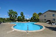 a large clear outdoor swimming pool