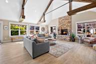 a living room with couches and chairs and a fireplace