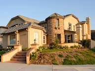 a large house with a staircase in front of it