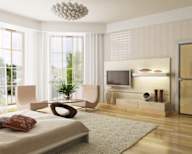 a bedroom with a bed and a tv