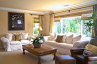 a living room with couches and a coffee table