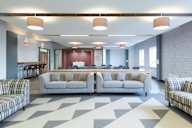a large living room with couches and a table
