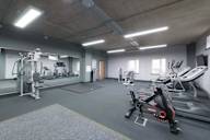a gym with a lot of exercise equipment in it