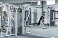 a gym with a lot of equipment in it