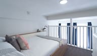 a bedroom with a bed and a balcony