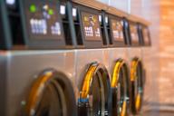 a row of washing machines in a building