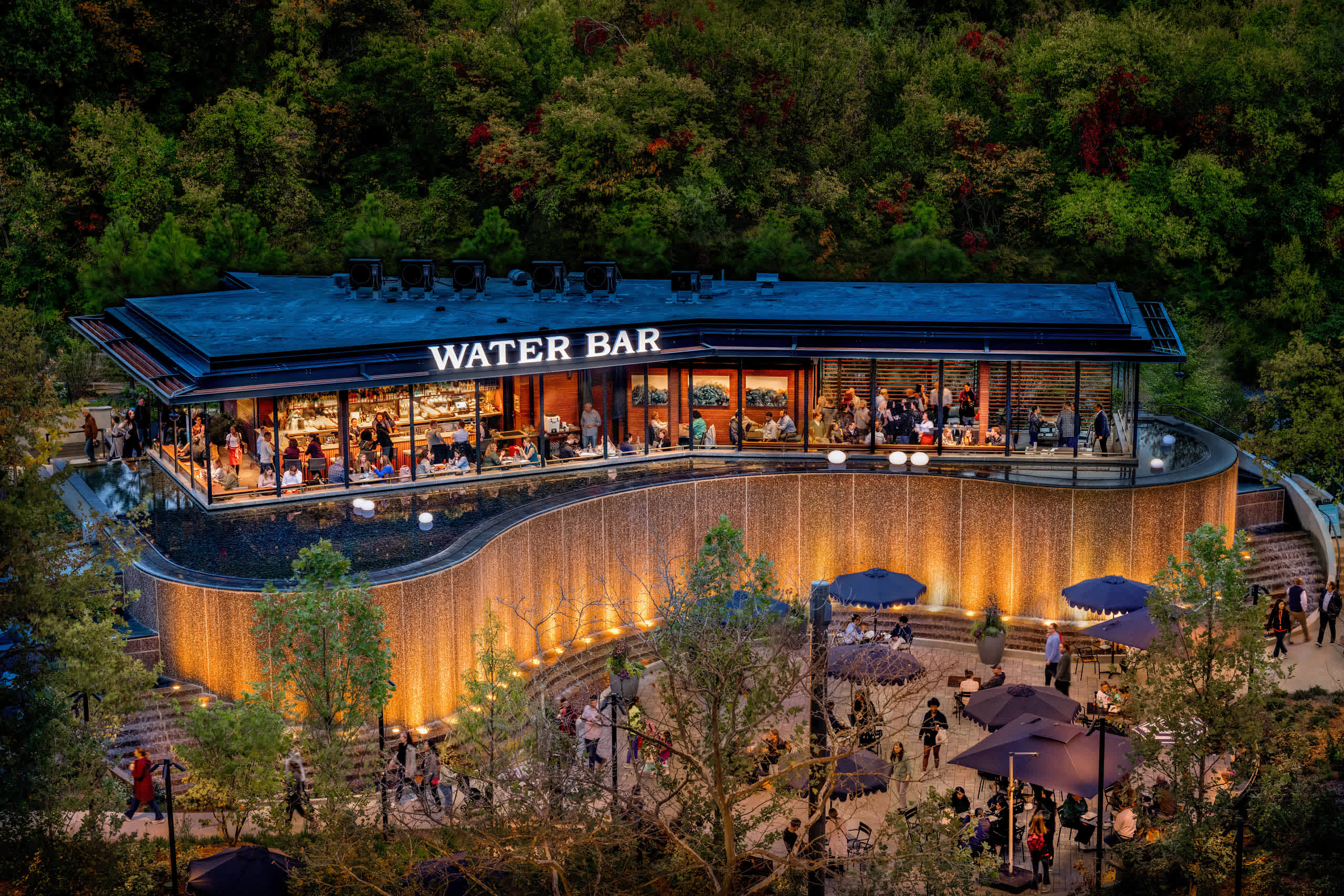 Water Park outdoor dining destination on Crystal Drive in National Landing at dusk