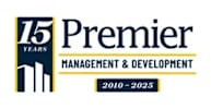 A logo for Premier Management & Development celebrating 15 years from 2010 to 2025.