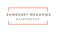 an orange box with the wordstered meadows apartments