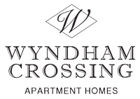 the logo for wynham crossing apartment homes