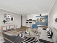 Living room with hardwood floors and blue accent wall.