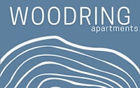A blue poster with the word "WOODRING" in white at the top and "apartments" in smaller white text below it.