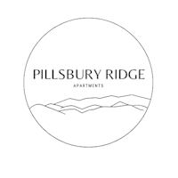 A logo for Pillsbury Ridge Apartments with a mountain range silhouette.