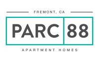 a black and green plate with the words parc apartment homes