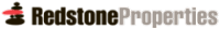 A red object is in front of a black and white image.