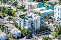 A view of a residential area with apartment buildings and a roundabout.