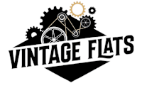 A logo with the words "Vintage Flats" and gears.