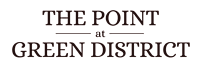 The image displays the text "The Point at Green District" in a serif font on a dark background.